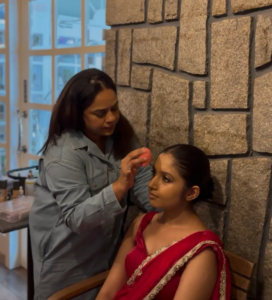 Client getting bridal makeup done