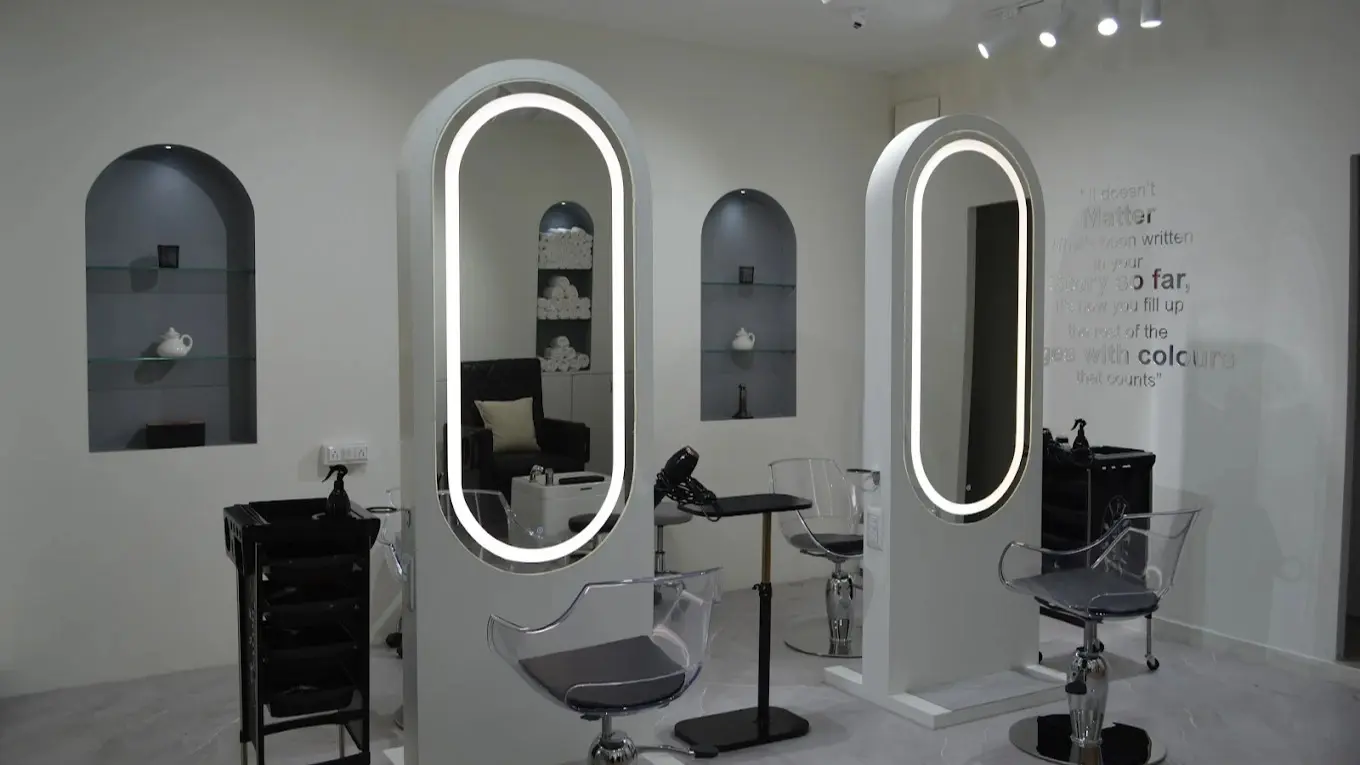 Moonlight Salon interior with lit arch mirrors